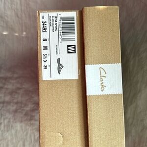 Black Collections by Clark’s sandals. New I box, never worn